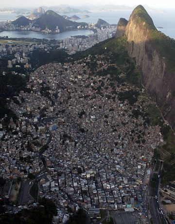 Aerial View of Rocinha Two Brothers Mountain looms over the favela on the